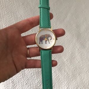 Turquoise watch with elephant